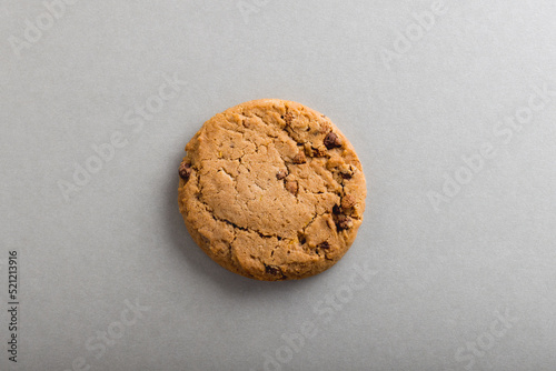 Overhead view of cookie on gray background with copy space