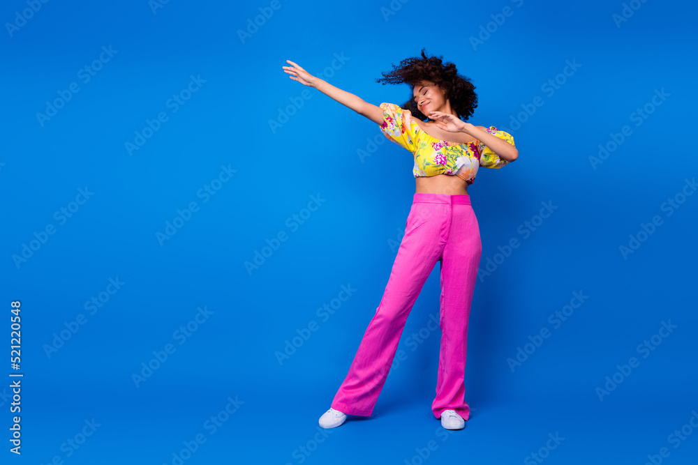 Full body photo of cute young woman wavy hair dance bachelorette party wear trendy colorful clothes isolated on vivid blue color background