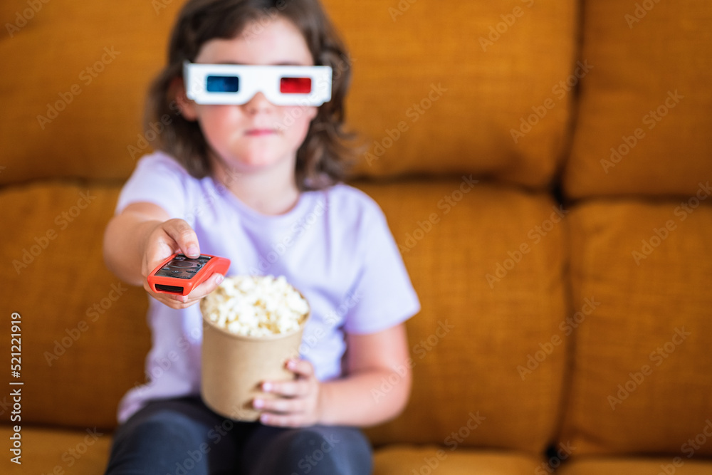 Girl in 3D glasses with popcorn watching movie Girl in 3D glasses with popcorn watching movie