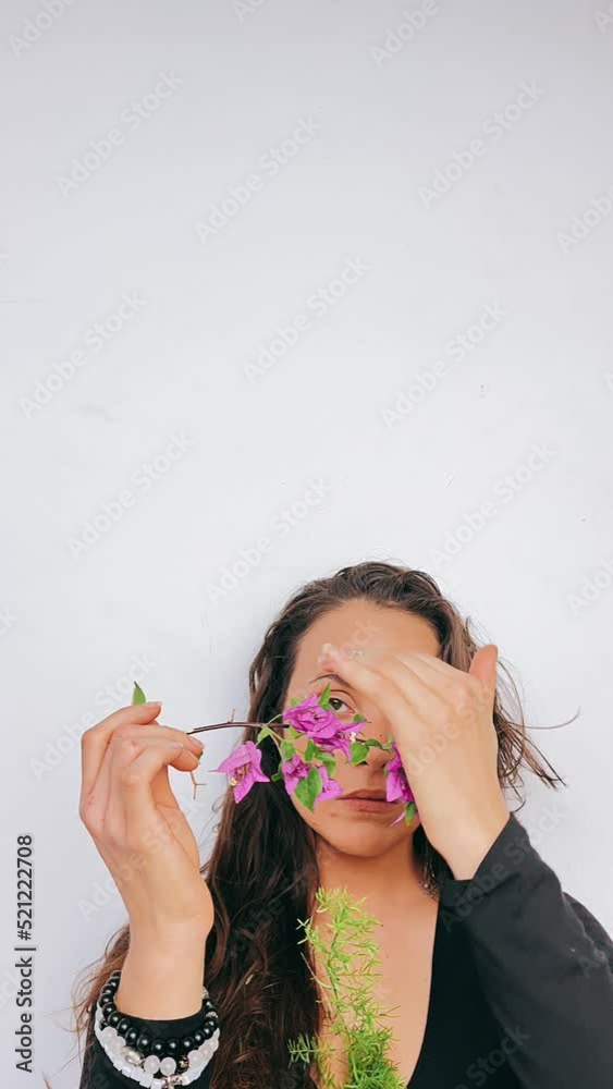 A pretty woman carresing Purple Flowers, Portrait of a woman with purple flowers, Purples Flowers, Beautiful Portrait of woman with flowers A pretty woman carresing Purple Flowers, Portrait of a woman with purple flowers, Purples Flowers, Beautiful Portrait of woman with flowers