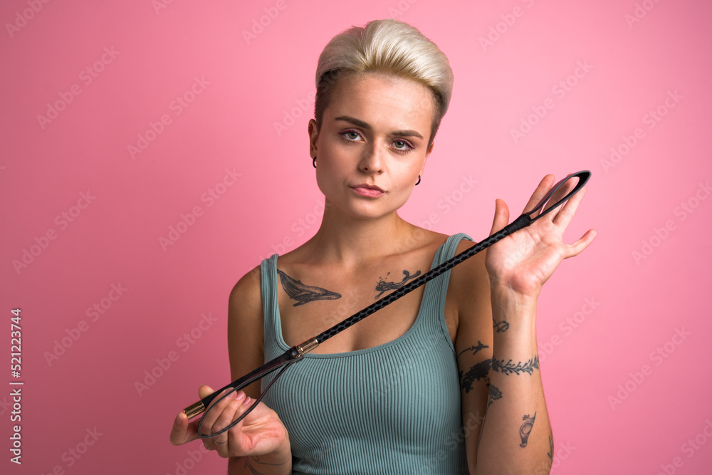 Confident Bdsm Woman Posing With Black Whip And Enjoying Dominance At Relationships Stock Foto 
