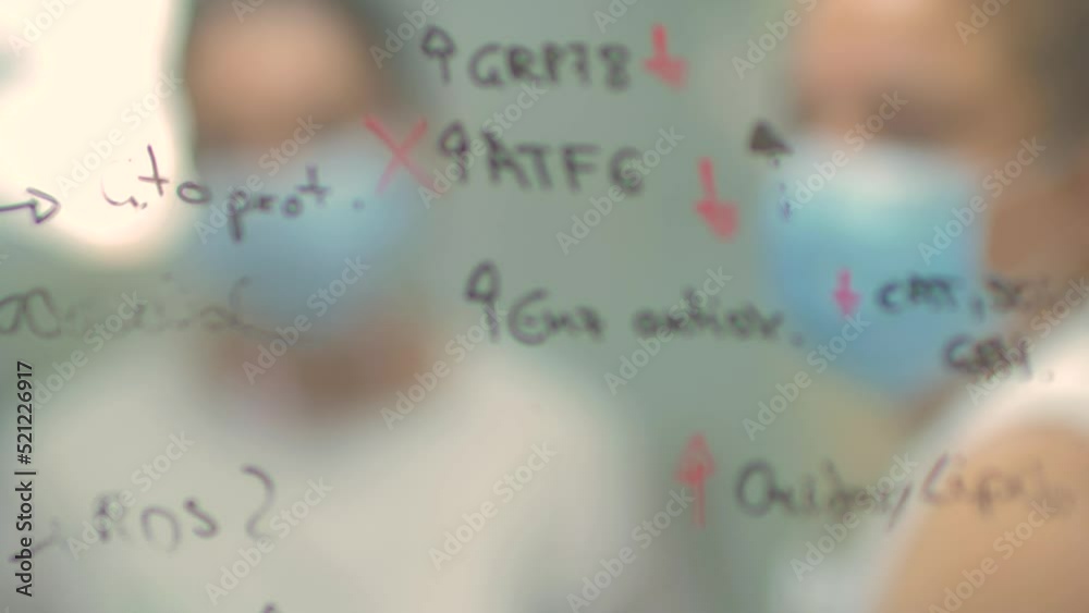 4k real time - hospital staff carrying out medical research in the laboratory with pipettes, test tubes, samples, etc...