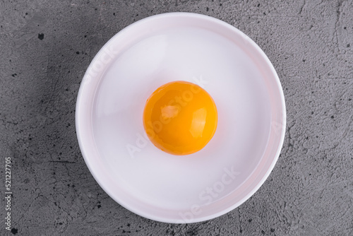 Fotobehang Egg yolk in bowl separated for cooking