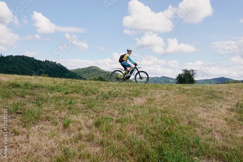 Cyclist riding high above the Toss Valley in Zurich, Switzerland photo