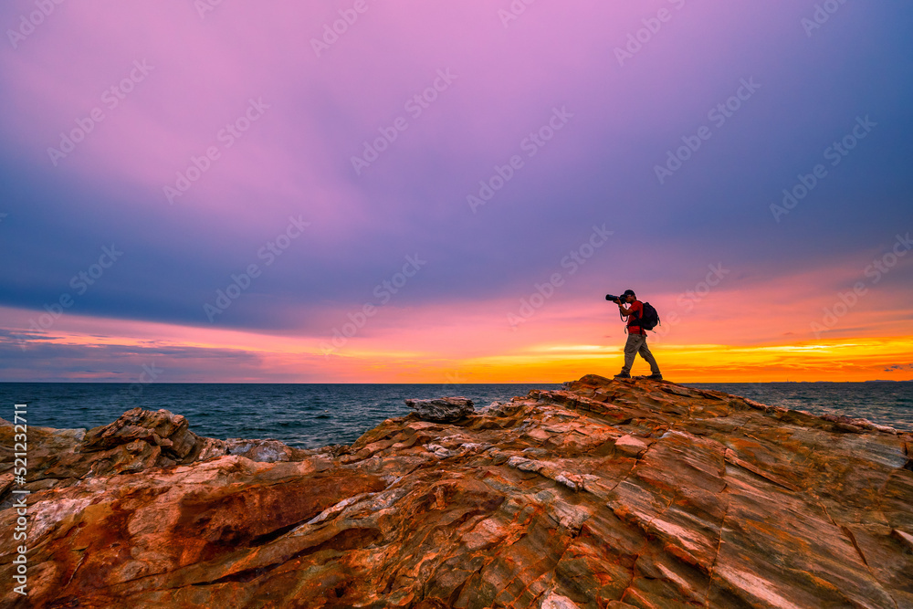 silhouette of a person on the top of the mountain