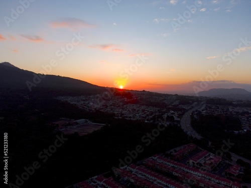 Aerial view of an urban residential area at sunset in Santa Tecla, El Salvador photo