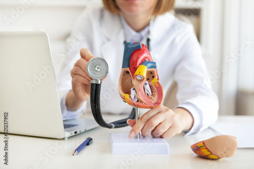 Close up of heart mockup with stethoscope close to it. Cardiology and healthcare concept