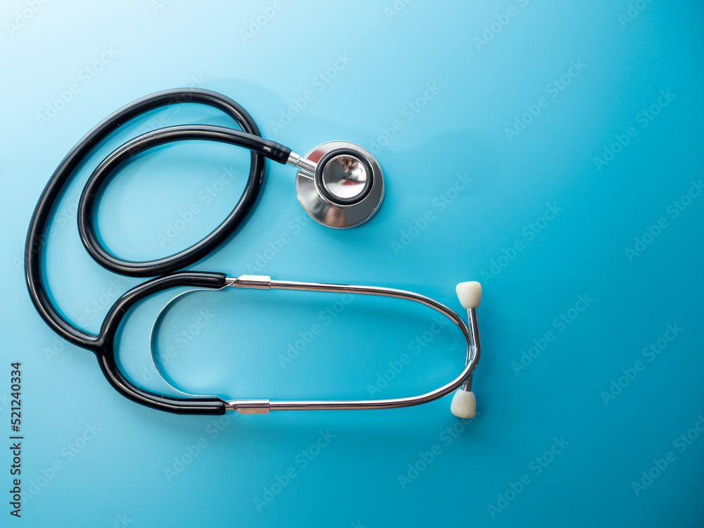 Medical stethoscope. Stethoscope on a blue background close-up. Medical stethoscope. Stethoscope on a blue background close-up.