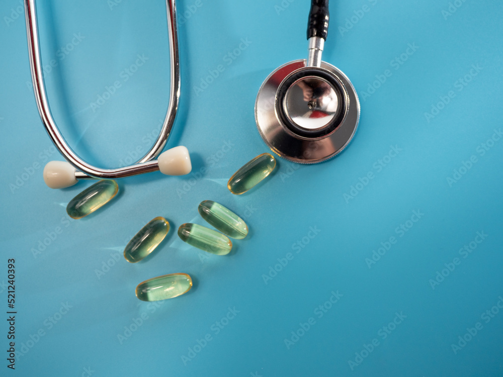 Medical stethoscope and medicines. Stethoscope and medicines close-up. Medical stethoscope and medicines. Stethoscope and medicines close-up.