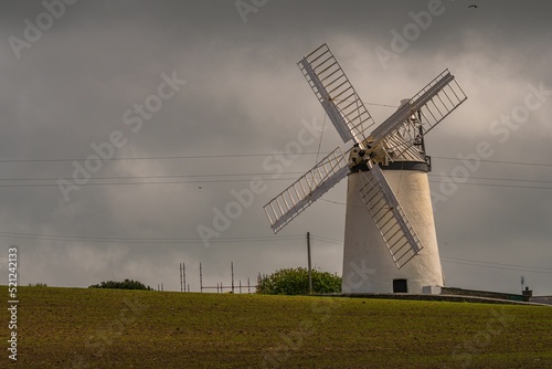 Beautiful shot of the traditional Ballycopeland windmill in cloudy weather photo