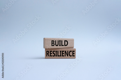 Build resilience symbol. Wooden blocks with words Build resilience. Beautiful white background. Business and Build resilience concept. Copy space.