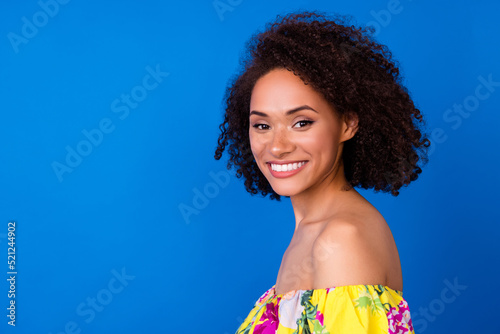 Profile photo of positive lovely lady beaming smile look camera empty space isolated on blue color background
