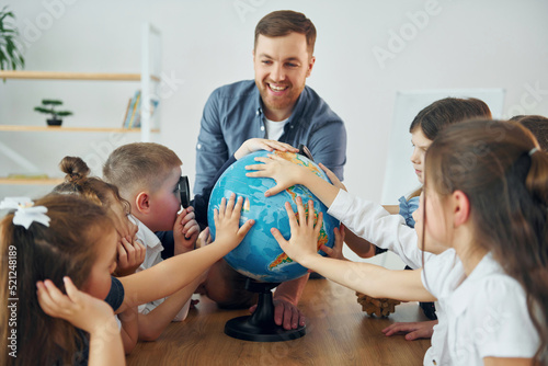 Valokuva Learning geography by using Earth globe