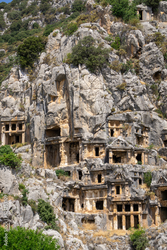 View of the Lycian tombs in the ancient city of Myra, climbed on the mountain on a sunny day. © Montse