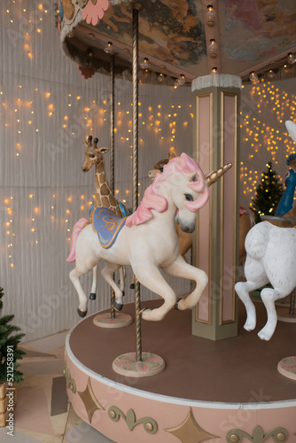 Carousel with animals in the interior of the room