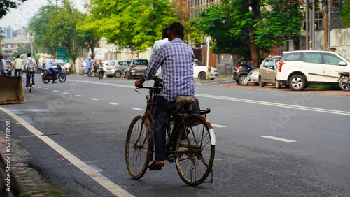 image of indian man going on bicycle.