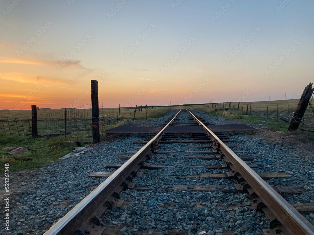 Fototapeta premium Train tracks at Sunset in the Country in California