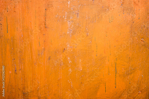 Old metal sheet paint with orange color with rust background