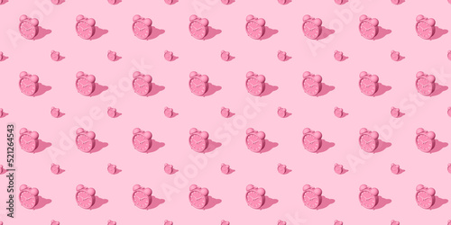 Pink alarm clocks big and small with shadow on pink background. Set. Seamless texture pattern. 3D illustration. Long shadow from the summer sunshine.