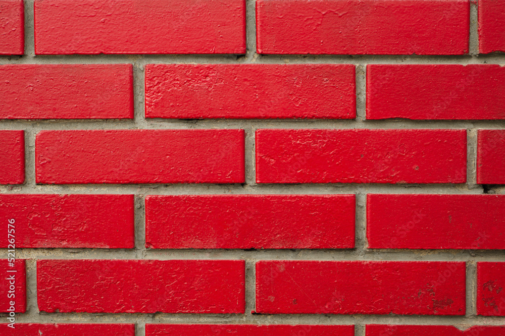 Obraz premium Bricks painted red. Texture, background for design, backdrop.