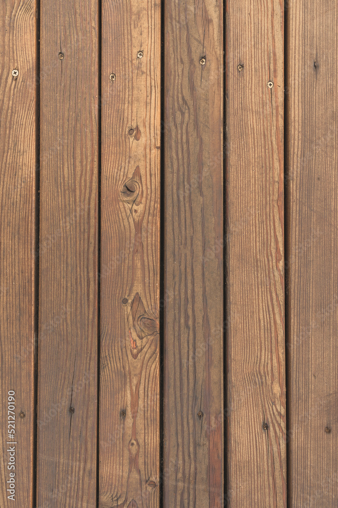 Fototapeta premium Brown wooden slats, worn texture, vertical photo