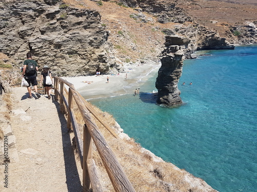 greece andros island beach called tis grias to pidima, rock high in the sea photo