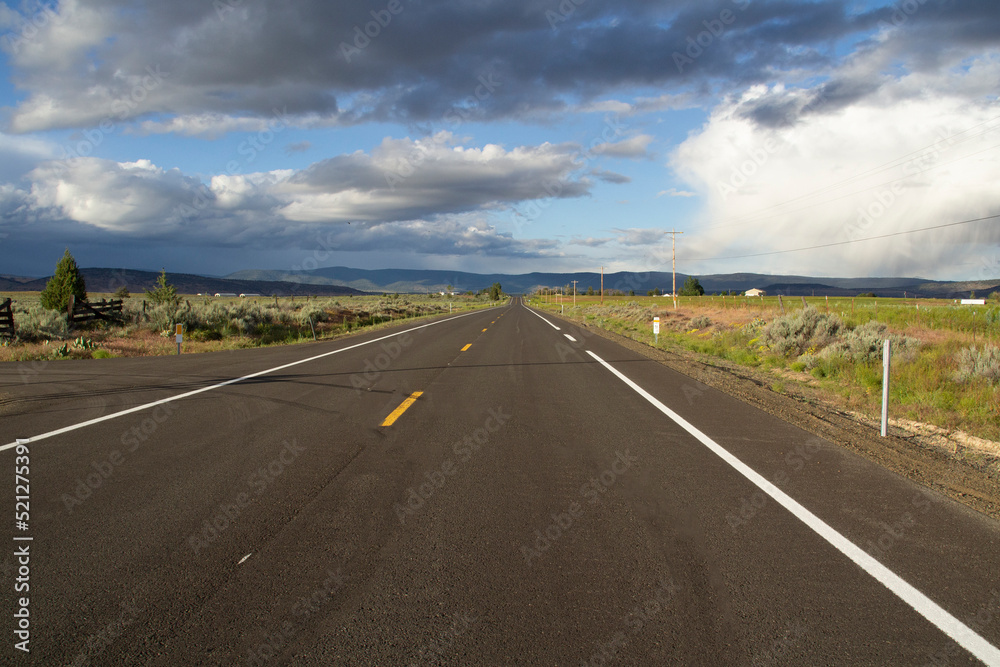 Long Straight Stretch of Paved Two Lane Road Under Cloudy Skies in Klamath County, Oregon