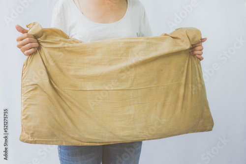 Wallpaper Mural Woman holding a pillow with dirty stains, yellow stains, sweat stains. Cleaning concept. Torontodigital.ca