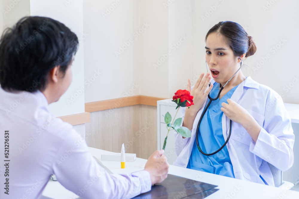 Fototapeta premium Relatives of patients gave roses to the doctor to show their love in the hospital.