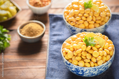 Arabic Cuisine; Middle Eastern traditional snack Lupin beans or Termes. It's very healthy beans that can be served as snack or antipasti. Close up with copy space.