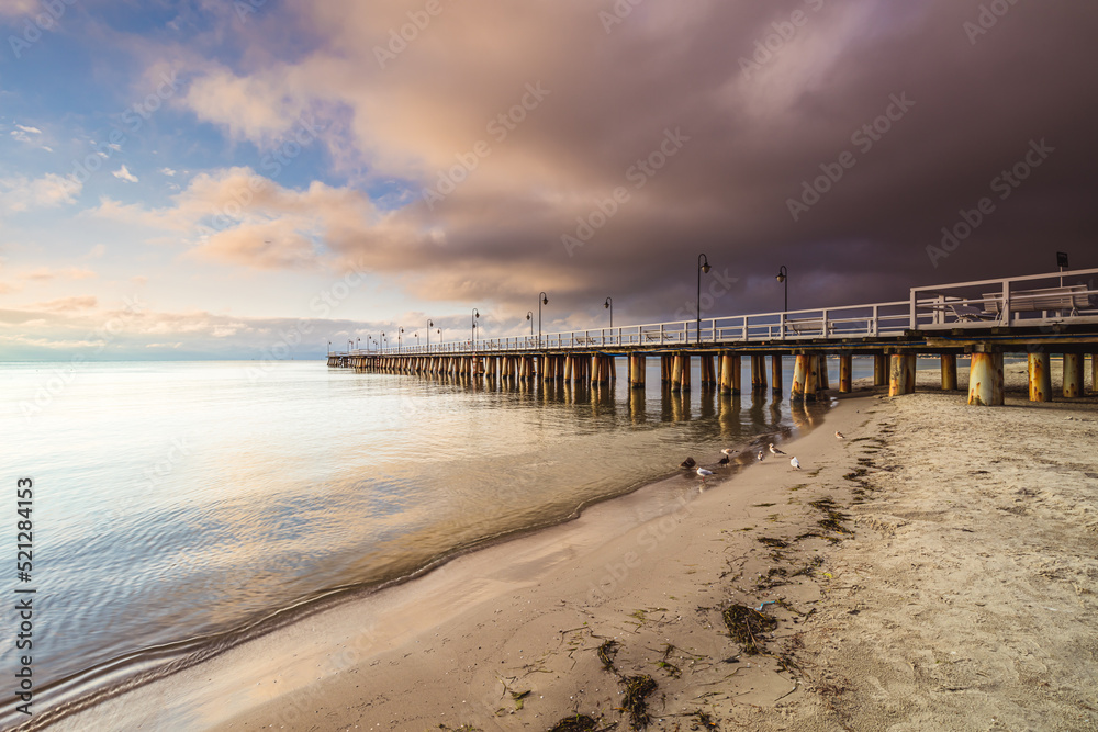 Amazing sunrise over the pier in Gdynia Orlowo