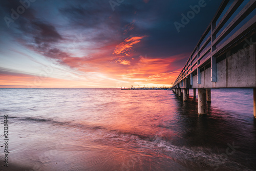 Obraz na płótnie pier at sunset in Mechelinki w salonie