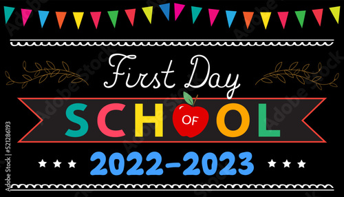First Day of School greeting card. Text 2022-2023, red apple on black school board with colorful garland. Back to school concept.	