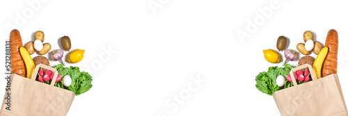 Fruits, vegetables and products in a paper grocery bag on a white background.