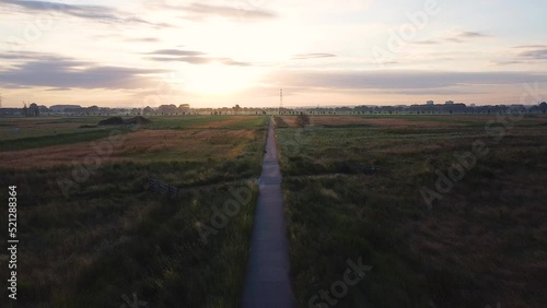 Beautiful view of a pathway in a field in Wageningen, Veenendaal, Gelderland, The Netherlands photo