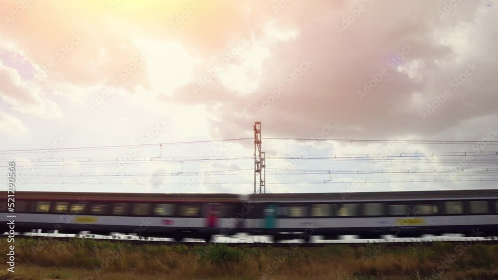 Modern high speed train. High speed passenger railway train. Passenger train running in the countryside. 