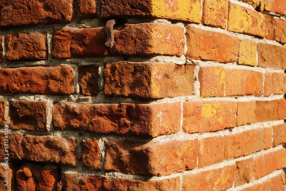 Fragment of a ceramic brick wall with white masonry mortar, white masonry seams, close-up Fragment of a ceramic brick wall with white masonry mortar, white masonry seams, close-up