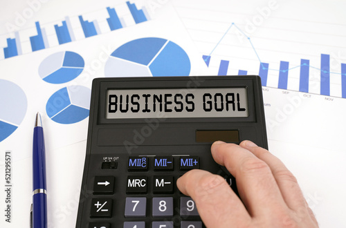 On documents with graphs and diagrams there is a calculator with the inscription - BUSINESS GOAL