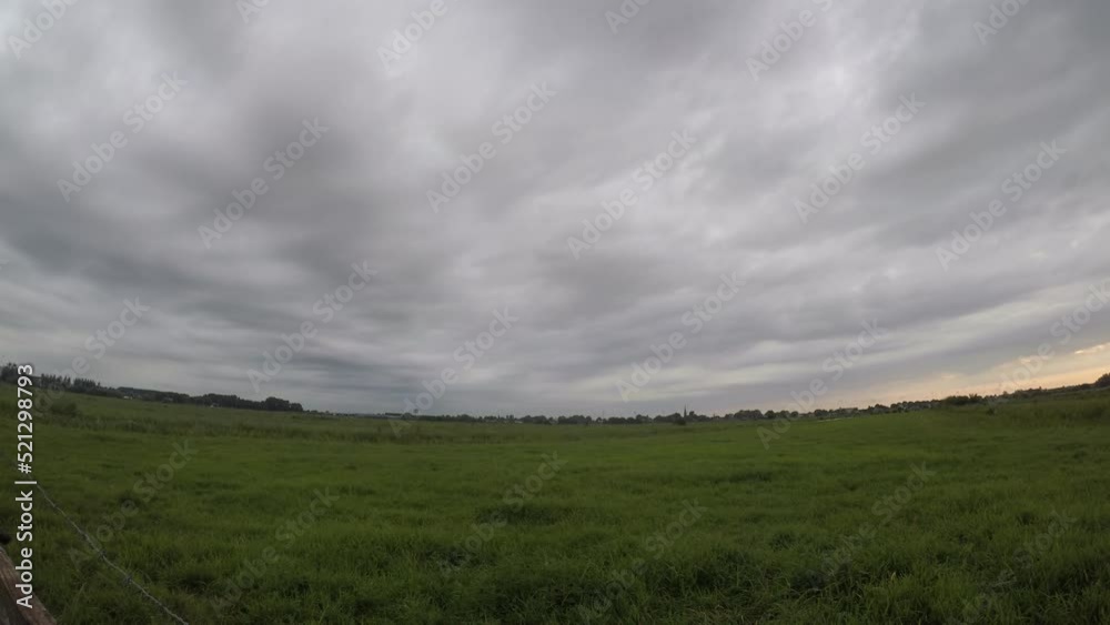 Time lapse of convective clouds with a smooth base moving over the observer in the Dutch polder landscape. Time lapse of convective clouds with a smooth base moving over the observer in the Dutch polder landscape.