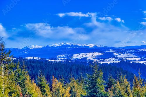 View over landscape covered with snow during sunny winter day. © Goran