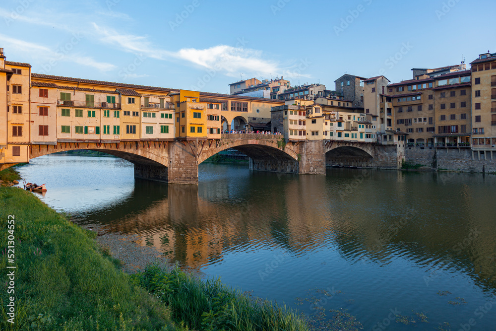 Ponte Vecchio in Florence with reflection in the water
