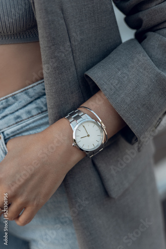 Beautiful stylish white watch on woman hand