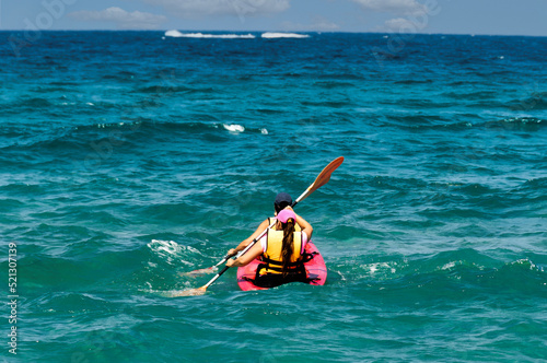 A guy and a girl are kayaking in the open sea © Benjamin Gelman