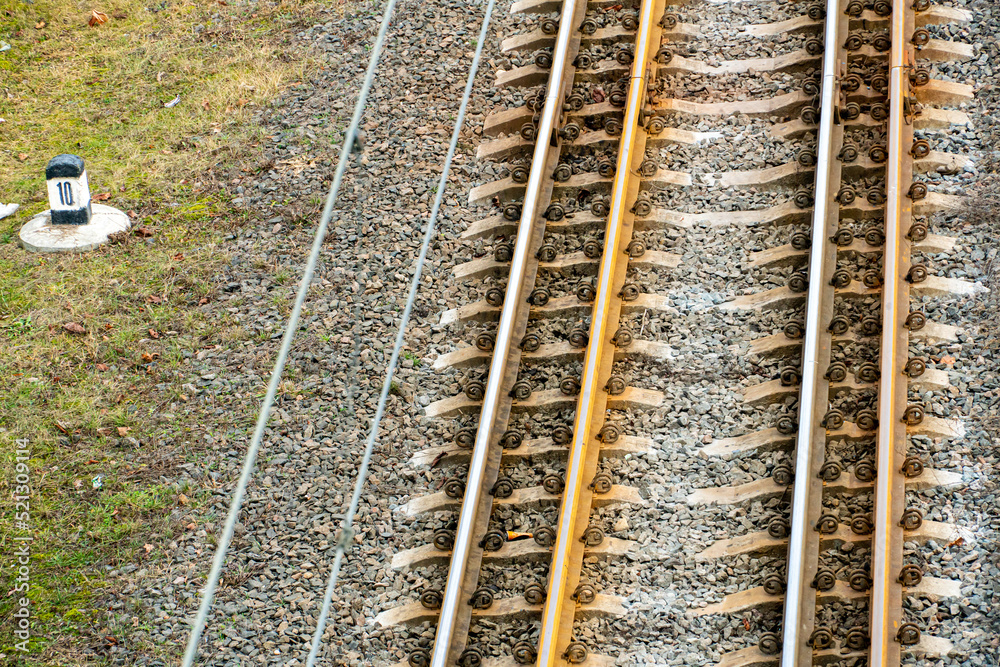 Railway and sleepers close-up. A major railway interchange near the station for train traffic, logistics between cities, cargo transportation. Railway and sleepers close-up. A major railway interchange near the station for train traffic, logistics between cities, cargo transportation.
