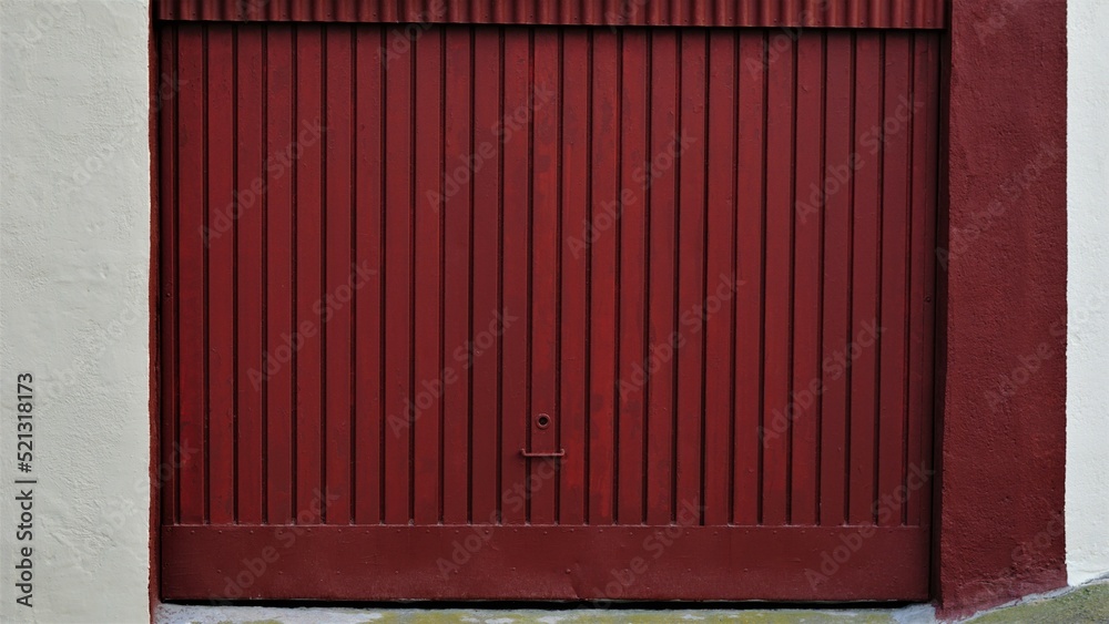 worn red garage door as background worn red garage door as background