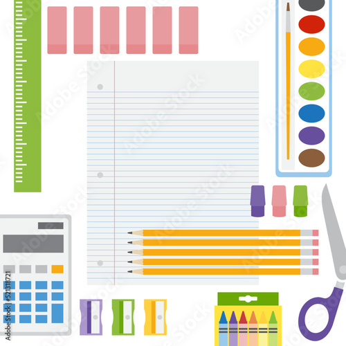 A set of school supplies arranged in an abstract collage, with paper and copy space in center
