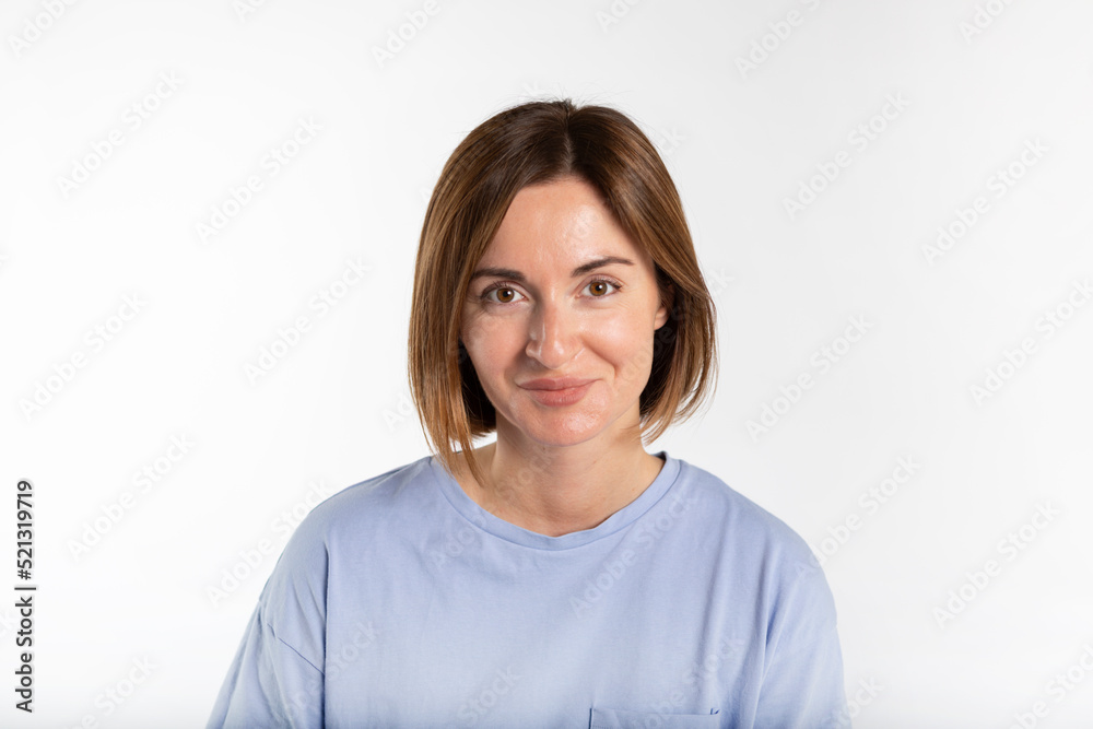 Portrait of young attractive woman smiling on a camera isolated on white background Portrait of young attractive woman smiling on a camera isolated on white background