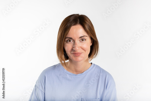 Portrait of young attractive woman smiling on a camera isolated on white background © Vitaliy