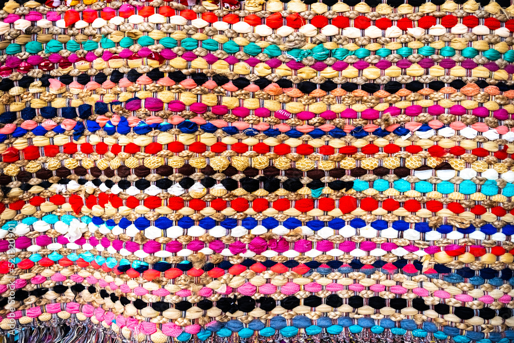 Background detail of a blanket embroidered in the traditional Mediterranean way with intertwined threads. Background detail of a blanket embroidered in the traditional Mediterranean way with intertwined threads.