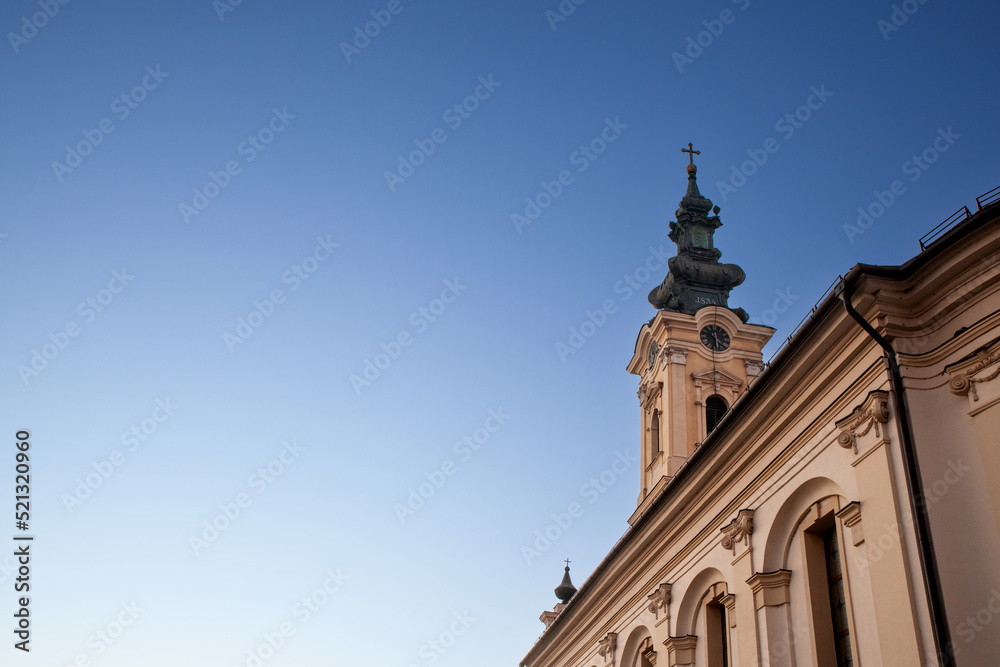 Steeple tower of hram uspenja presvete bogorodice, the Serbian orthodox Church of Crepaja a 19th century old Austro Hungarian style church, with its typical baroque clocktower. ....